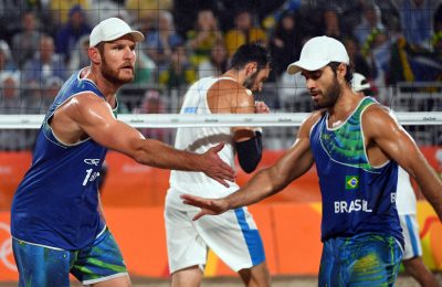 BEACH VOLLEY - 2016 - JO 2016 Aug 18, 2016; Rio de Janeiro, Brazil; Alison Cerutti (BRA) and Bruno Oscar Schmidt (BRA) celebrates a point against Paola Nicolai (ITA) and Daniele Lupo (ITA) during the men's beach volleyball gold medal match in the Rio 2016 Summer Olympic Games at Beach Volleyball Arena. Mandatory Credit: Jack Gruber-USA TODAY Sports